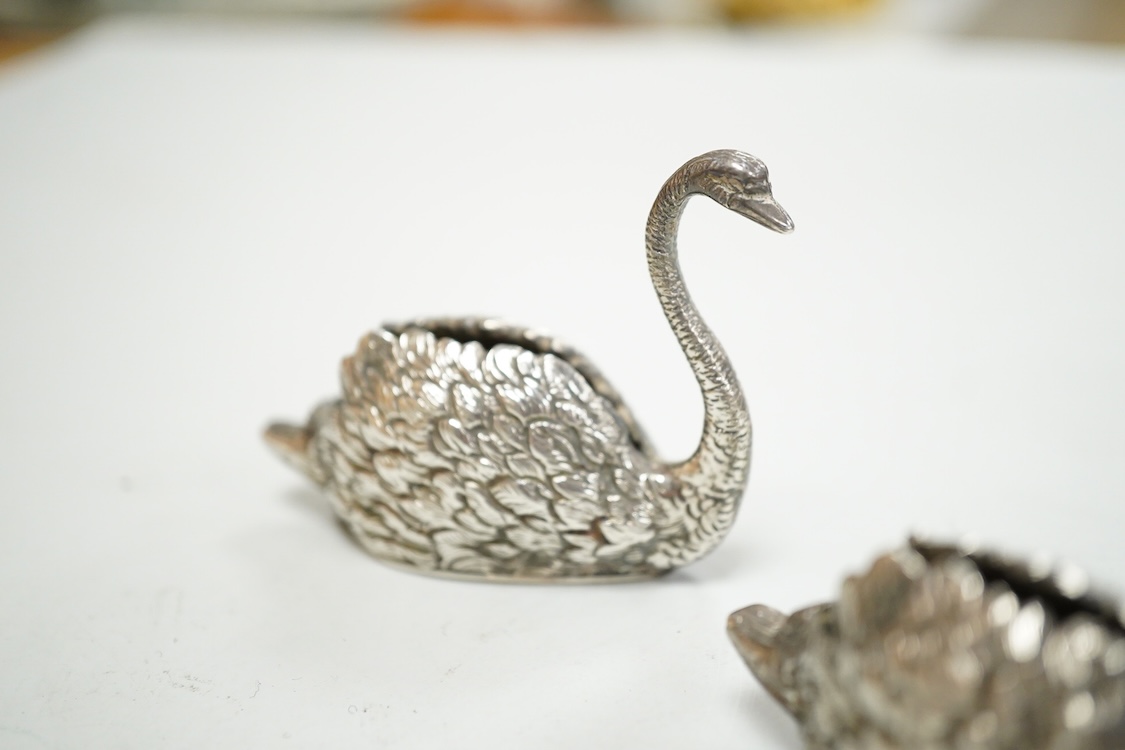 A pair of modern silver swan menu holders, maker E.A.W., Birmingham, 1975, height 44mm.